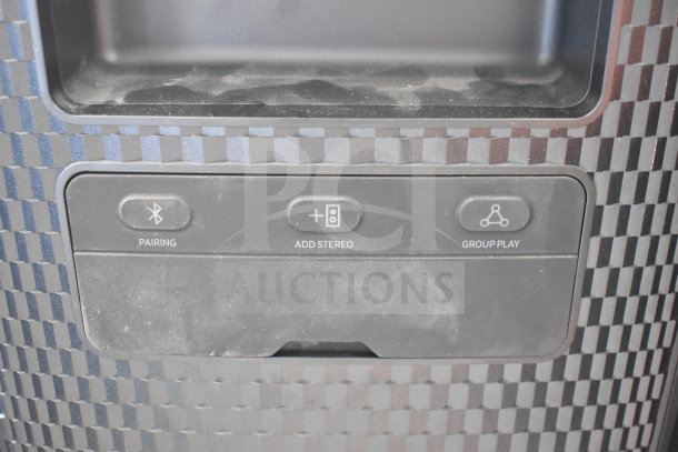 Close-up of Samsung MX-ST4CB speaker interface, showing buttons for pairing, add stereo, and group play functions.