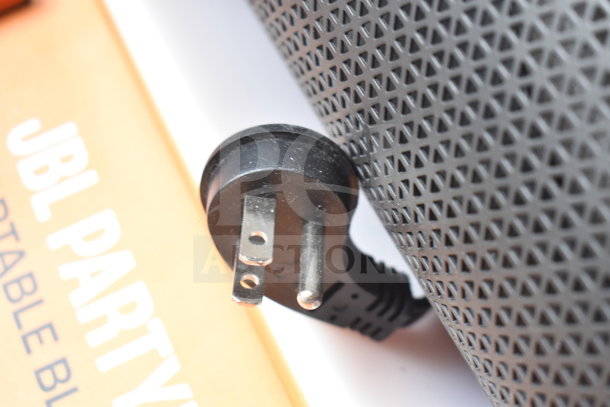JBL Partybox 110 speaker, store display with power plug, features portable Bluetooth connectivity. Includes original packaging.