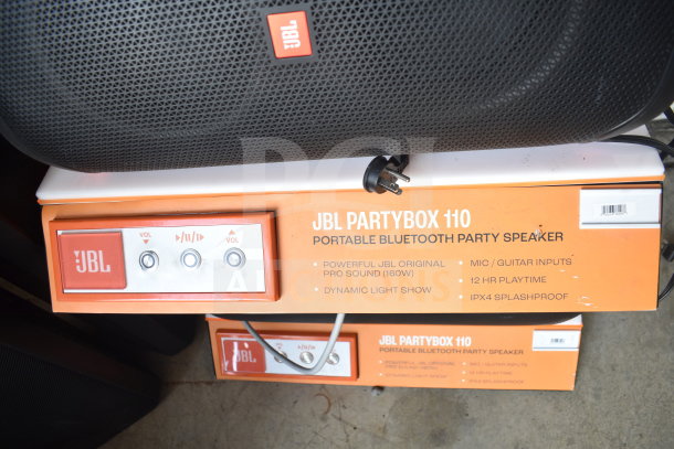 JBL Partybox 110 store display, featuring Bluetooth speaker with 160W sound, dynamic light show, mic/guitar inputs, 12-hour battery, IPX4 splashproof.