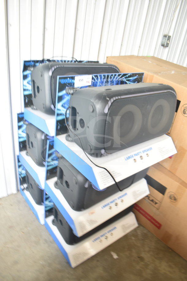 Six Onn Large Party Speakers in original packaging, displayed in a store setting, indicating new condition.