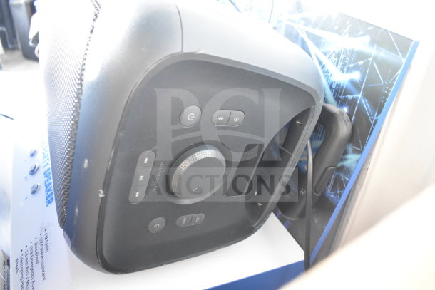 Onn Large Party Speaker with control panel, volume knob, and connectivity buttons. Used as store display.