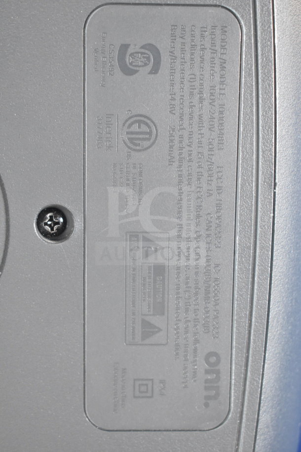 Engraved label on an Onn Large Party Speaker, model 10009942138, showing regulatory and battery information, 2500mAh.