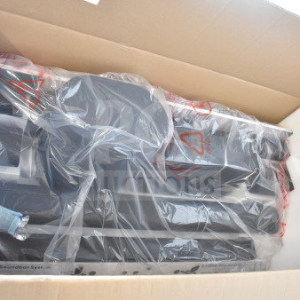 Cardboard box containing Onn speakers and soundbars wrapped in protective plastic. Packaging appears intact and new.