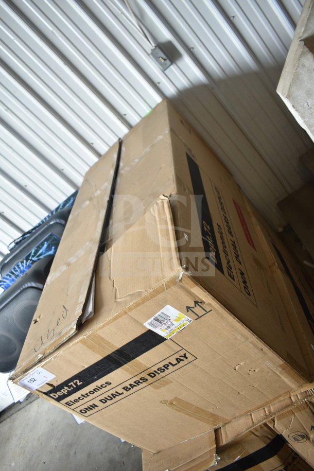 Cardboard box labeled "Dept. 72 Electronics ONN DUAL BARS DISPLAY". Box is taped and shows signs of wear.