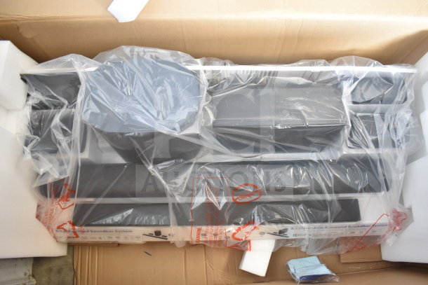 Store display of Onn speakers and soundbars, packaged in plastic wrap. Includes multiple components, in new condition.