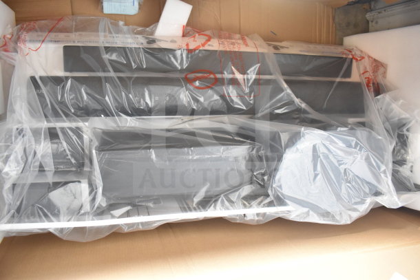 Store display of Onn speakers and soundbars wrapped in plastic, new condition, packaged in a cardboard box.