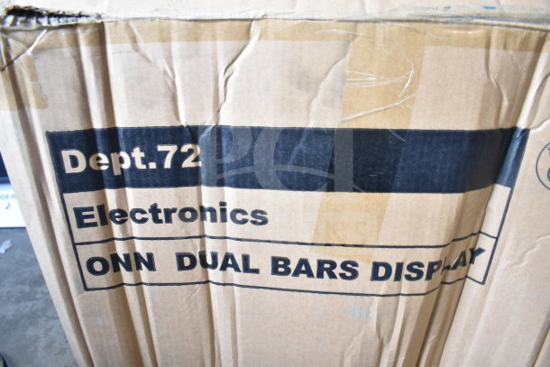 Cardboard box labeled "Dept. 72 Electronics ONN Dual Bars Display," slightly worn, contains Onn speakers and soundbars for display.