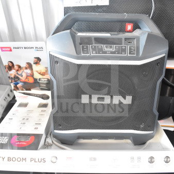 Ion Party Boom Plus speaker on display stand, features Bluetooth connectivity and microphone inclusion, excellent condition.
