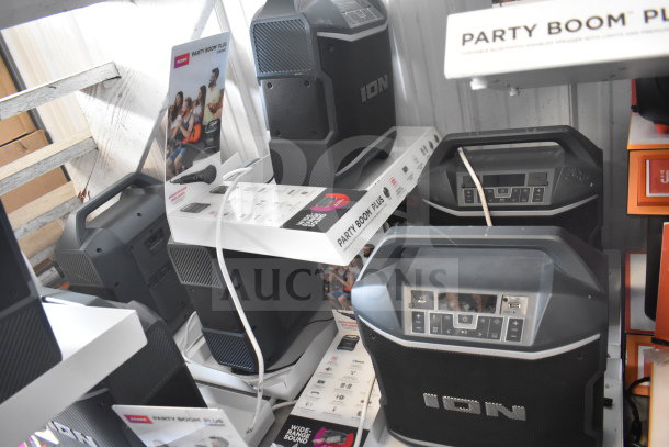 6 Ion Party Boom Plus speakers on display. Black, wide-range sound, Bluetooth-enabled, portable. New condition.