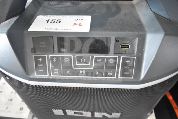 Ion Party Boom Plus speaker display with control panel, USB port, and EQ settings. Auction label shows quantity six.