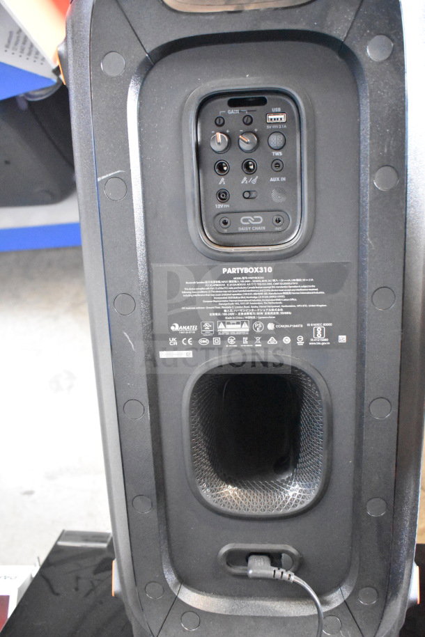 JBL Partybox 310 speaker panel with controls, labels, and ports visible. Black, in-store display model.