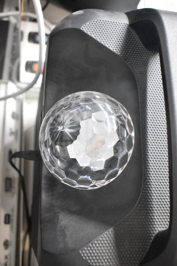 Ion Party Rocker Max speaker with crystal-like dome light, shown in close-up, featuring textured speaker grill.