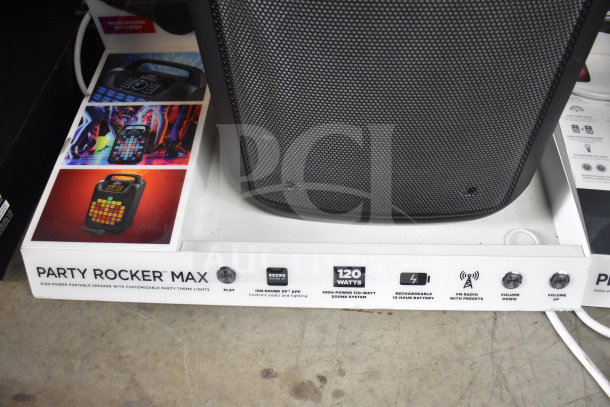 Ion Party Rocker Max speaker display. Features 120 watts, rechargeable battery, customizable lights, and built-in FM radio.