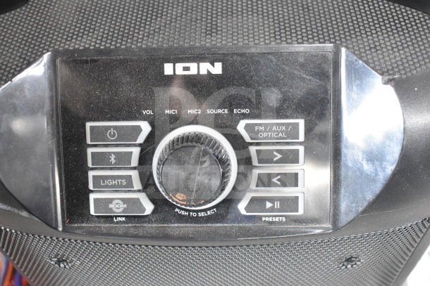 Ion Party Rocker Max speaker with control panel, featuring volume, mic, Bluetooth, and lighting options; used condition.