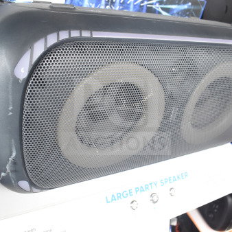 Onn large party speaker on store display, featuring dual drivers and sturdy design. Good condition, promotional label visible.