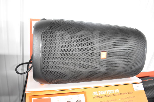 JBL Partybox 110 Bluetooth speaker on display. Features include vibrant sound, portable design, and karaoke inputs. Mint condition.