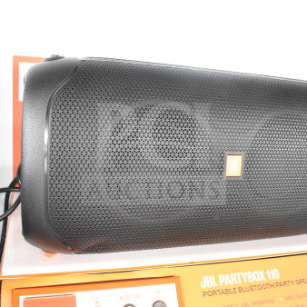 JBL Partybox 110 Bluetooth speaker on display. Features include vibrant sound, portable design, and karaoke inputs. Mint condition.