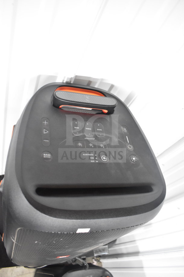 JBL Partybox 310 speaker, black, with control panel showing bass, treble, echo options. Auction includes 4 store displays.