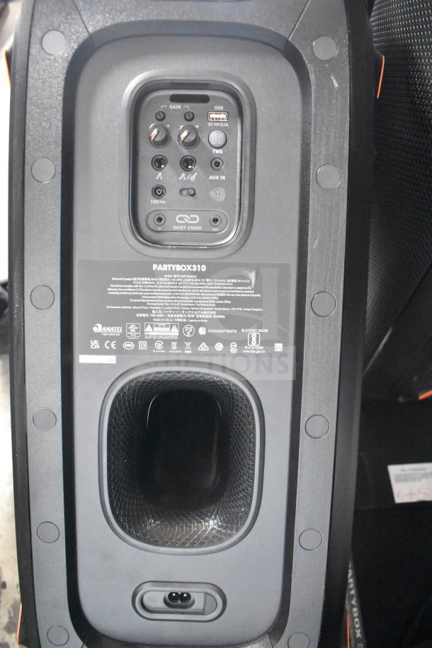 JBL Partybox 310 speaker display unit; features USB, AUX, Daisy Chain ports. Model marking visible.