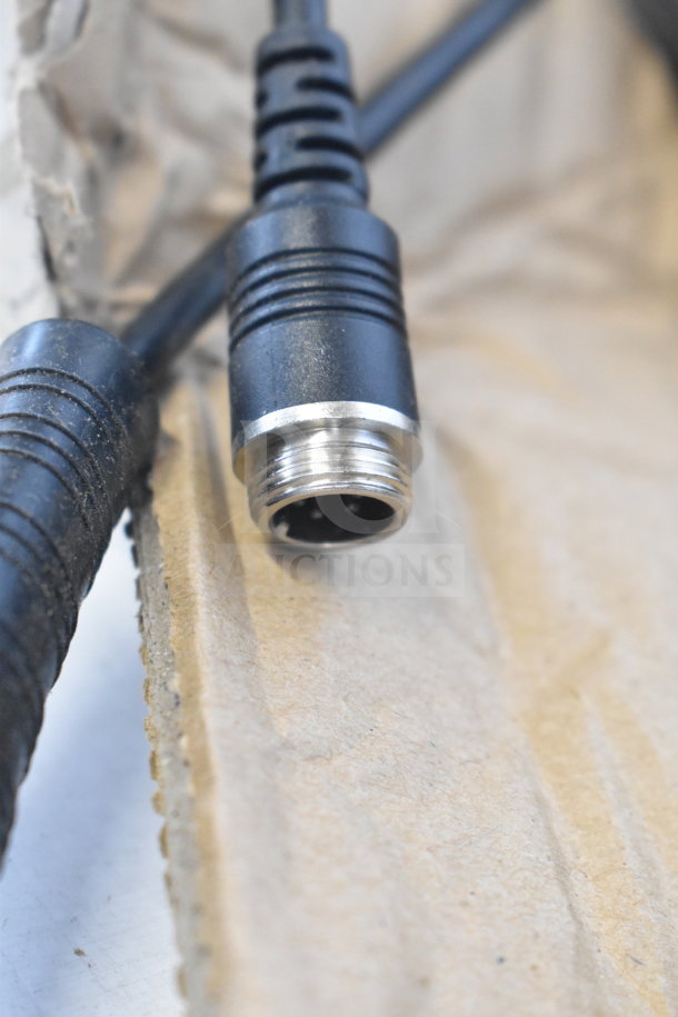 Black cable with metal connector, part of a 10m cable box. Mild wear visible on connector. Suitable for electrical use.