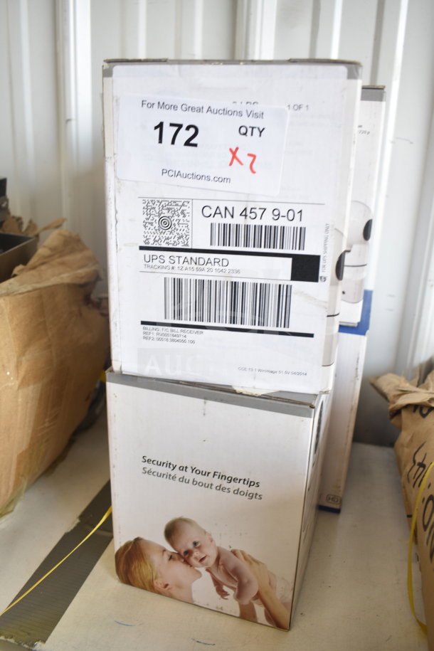 "Home Wi-Fi Security Camera, 2 units in original box, new condition. Features include monitoring capability and easy setup."