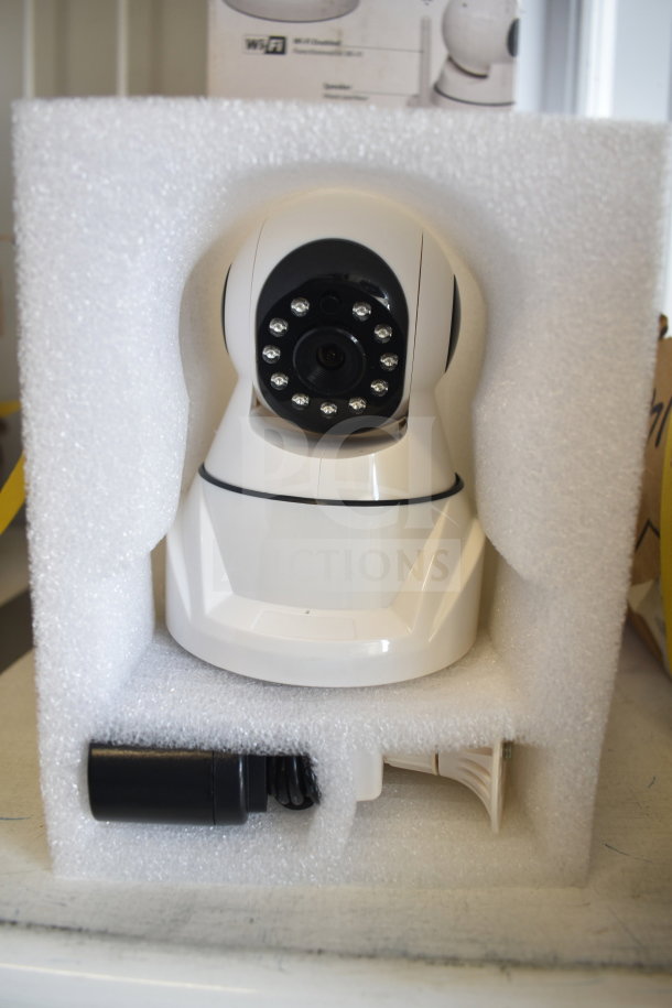 Home Wi-Fi security camera in original packaging with mounting accessories, unopened, pristine condition.
