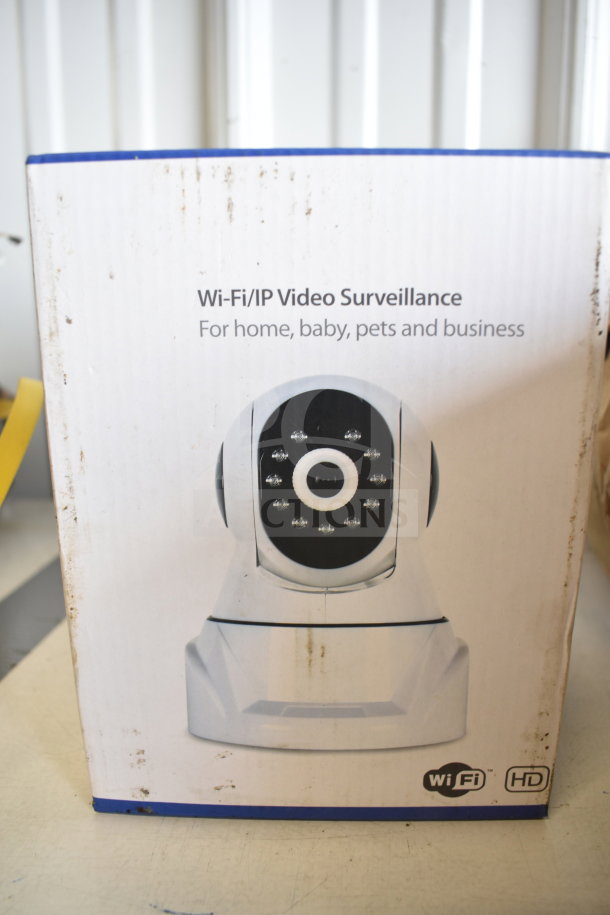 Boxed Wi-Fi/IP Video Surveillance Camera, ideal for home or business, HD quality. Visible branding and icons on packaging.