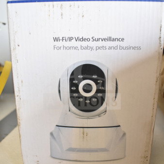 Boxed Wi-Fi/IP Video Surveillance Camera, ideal for home or business, HD quality. Visible branding and icons on packaging.