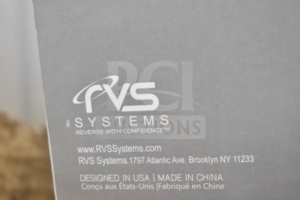 Box label for RVS Systems Wi-Fi Video Surveillance Camera, showing brand, website, and address. Designed in USA, made in China.