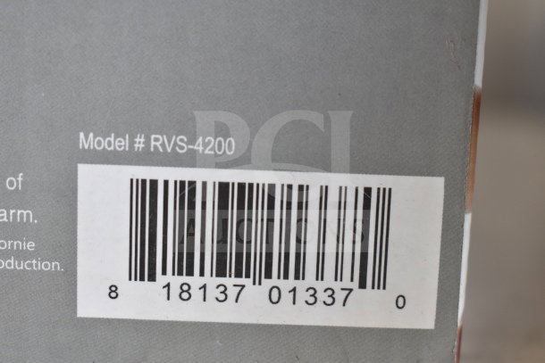 Wi-Fi Video Surveillance Camera, Model #RVS-4200, in original box, barcode visible.
