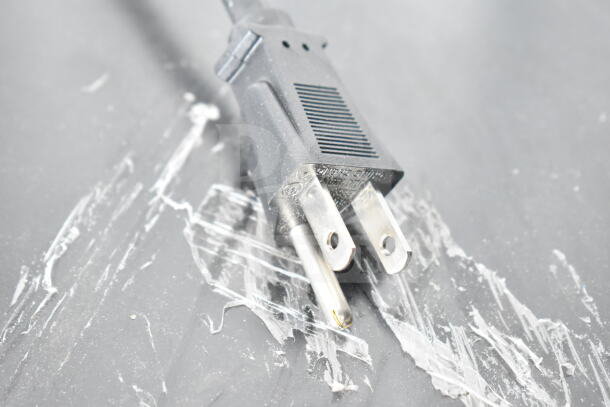 Close-up of a standard electrical plug for the 2023 IDW G-4SI-N-2-3-4-B-5 Mini Cooler Merchandiser, 115 Volts, 1 Phase.