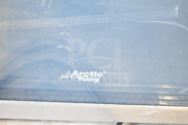Arctic King ARV115B1AST Mini Cooler Merchandiser, 115V. Visible brand logo on glass, sleek design.