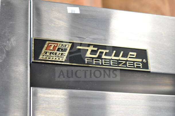 True T-19F Commercial Single Door Reach-In Freezer, stainless steel, on casters, features True logo and label.