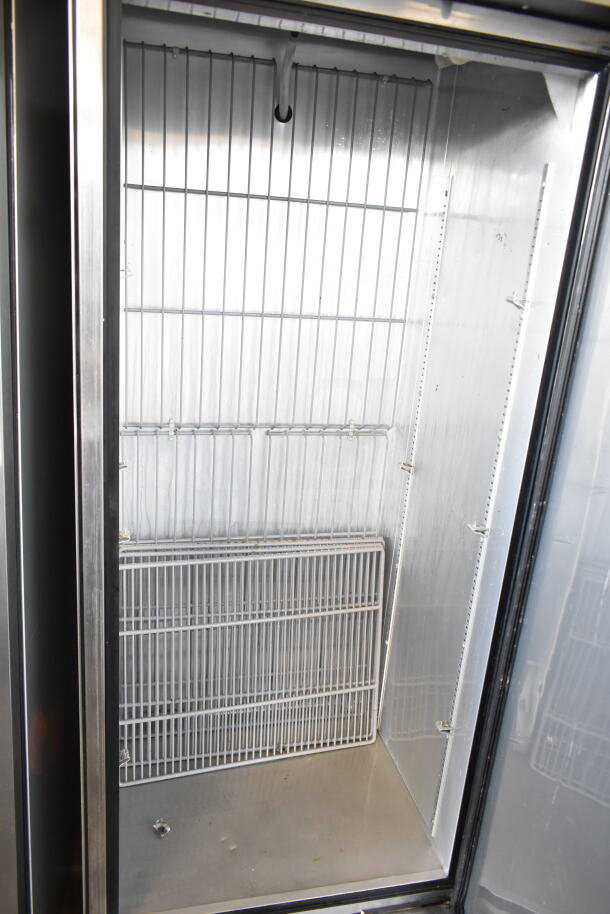 True T-19F commercial single door reach-in freezer on casters, clean interior, 115 volts, 1 phase, adjustable shelves.