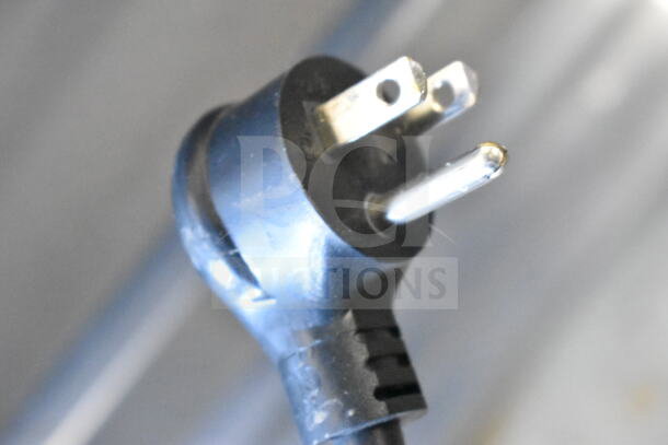 Close-up of a three-prong power plug for the 2018 True T-19F-HC freezer, showing connection type.