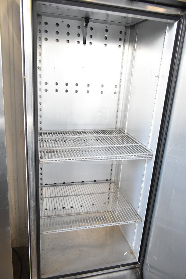 2018 True T-19F-HC single door commercial freezer, shelves visible, on casters, 115 volts, clean interior.