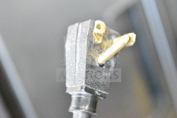 Close-up of the power plug for a 2019 True T-35-HC Commercial 2 Door Reach In Cooler, showing a standard 115 volt connector.