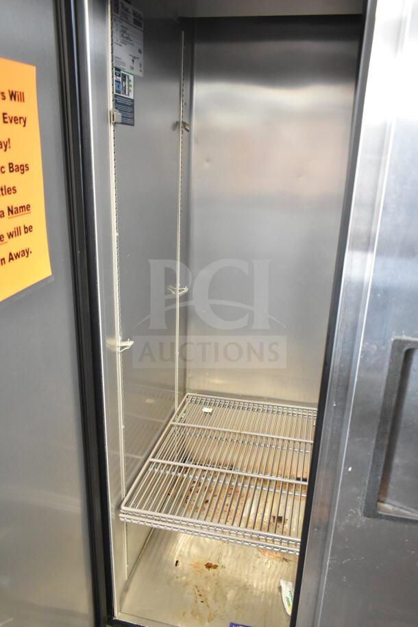 2019 True T-35-HC Commercial 2 Door Reach-In Cooler, 115 Volts, interior view with shelving and visible label.