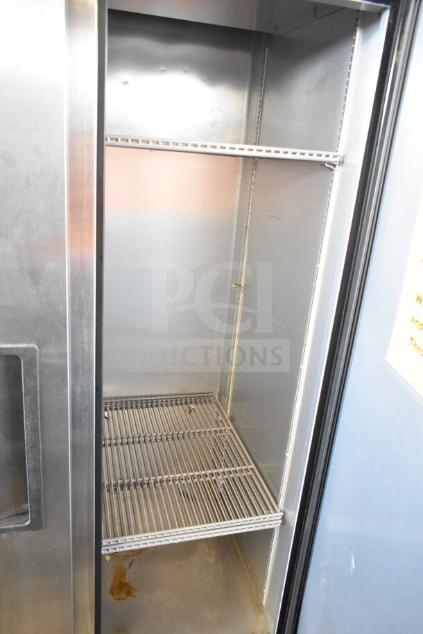 2019 True T-35-HC Commercial 2 Door Reach-In Cooler, stainless steel interior, visible shelving, 115 Volts, 1 Phase.