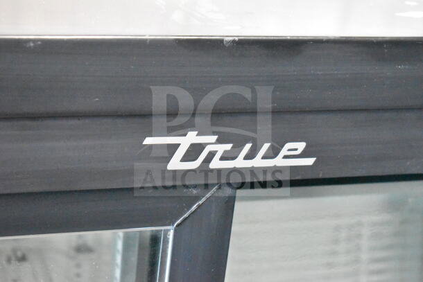 2018 True GDM-41SL-48-HC-LD cooler merchandiser, logo detail, commercial two-door, 115V, 1 phase, black finish.