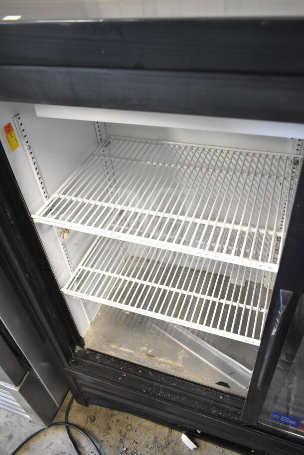 2018 True GDM-41SL-48-HC-LD 2 Door Cooler; shelves, 115V, 1 Phase; used condition; visible wear at base.