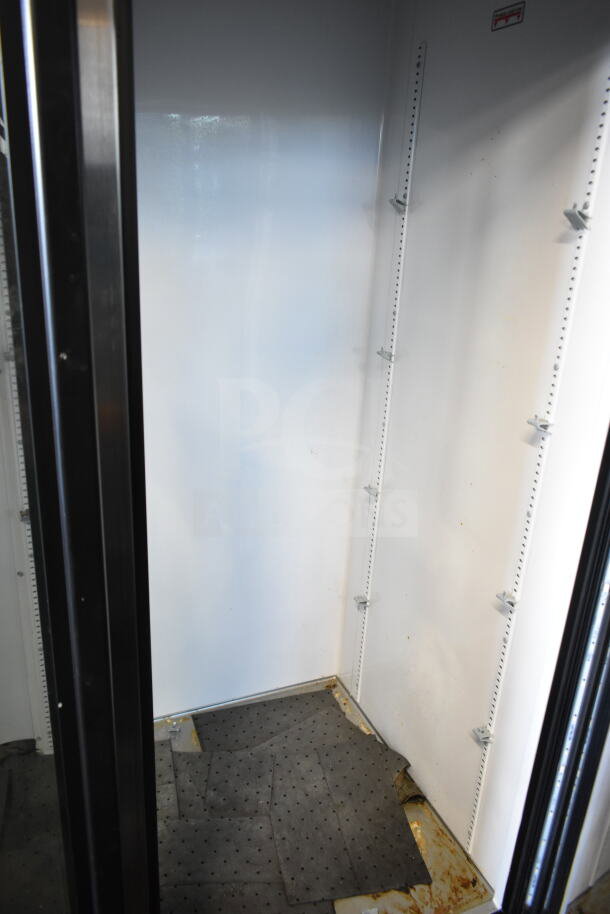 2019 True GDM-72-HC 3 Door Cooler in used condition; shows interior and shelving mounts. 115 Volts, 1 Phase.
