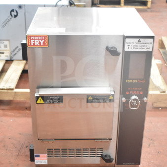 Brand new Perfect Fry PFC730 ventless countertop fryer, semi-automatic, 230/400V, 3-phase, with caution labels.