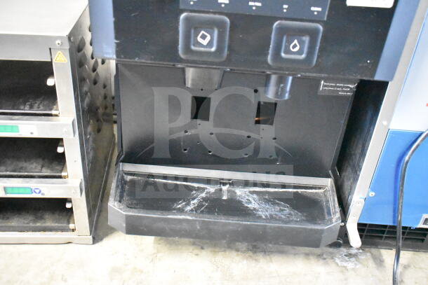 Scotsman W-HID207ABX-1A commercial ice and water dispenser, 196 lb capacity, push-button controls, some surface wear visible.