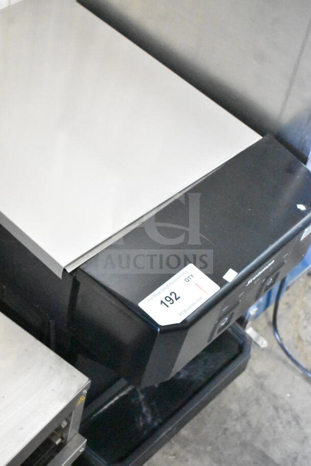 Scotsman W-HID207ABX-1A 196 lb countertop water and nugget ice dispenser, push-button, 115V. Auction tag 192 visible.