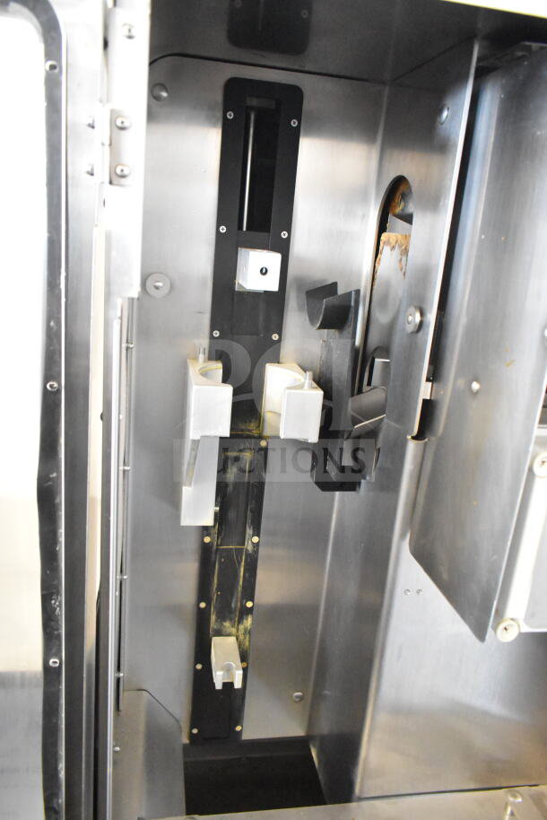 JBT 2ND-GEN-MFJ-HE commercial citrus juicer interior, stainless steel finish, on commercial casters, 115V, 1 Phase.