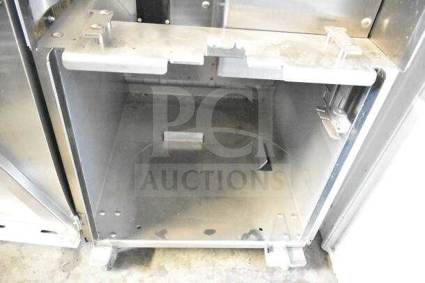 Commercial JBT citrus juicer with casters, model 2ND-GEN-MFJ-HE. Stainless steel exterior, shows signs of use. 115V, 1 Phase.