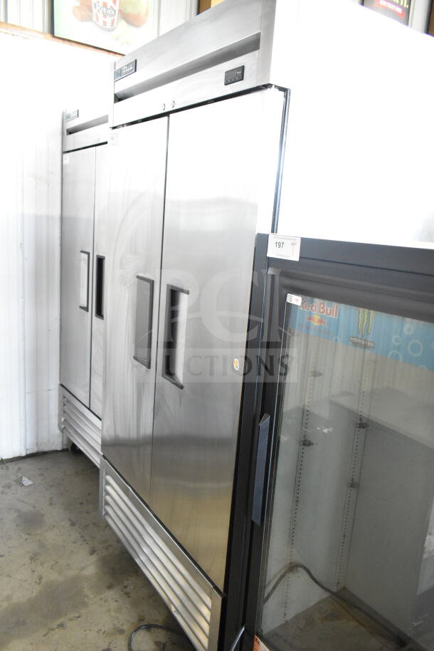 2018 True T-35-HC commercial 2-door cooler, stainless steel, 115 volts, 1 phase, excellent condition, auction tag visible.
