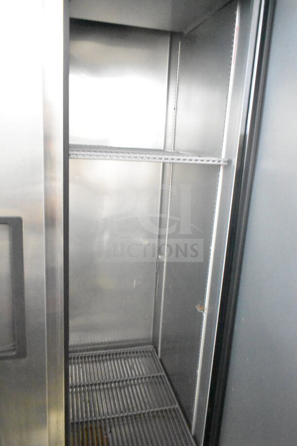 2018 True T-35-HC Commercial 2 Door Reach-In Cooler. Features include 115 volts, 1 phase, and metal shelving.