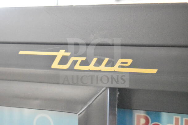 True GDM-41SL-60-LD 2 Door Cooler Merchandiser, 115 Volts, 1 Phase, logo detail, commercial use, good condition.